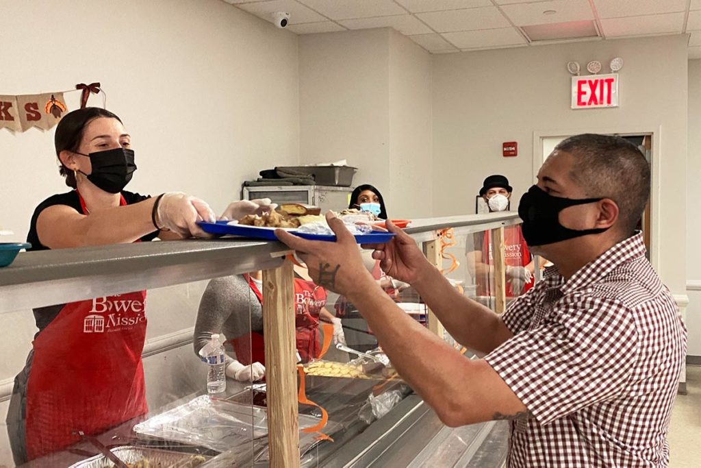 Volunteer serving meal